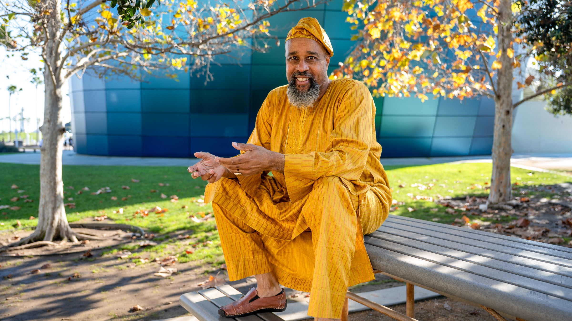 Yellow clothed man on bench