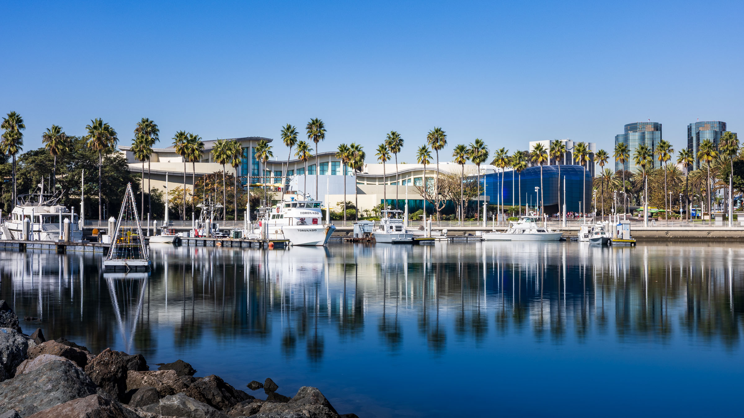 View of Aquarium showing nearby harbor and boats at docks