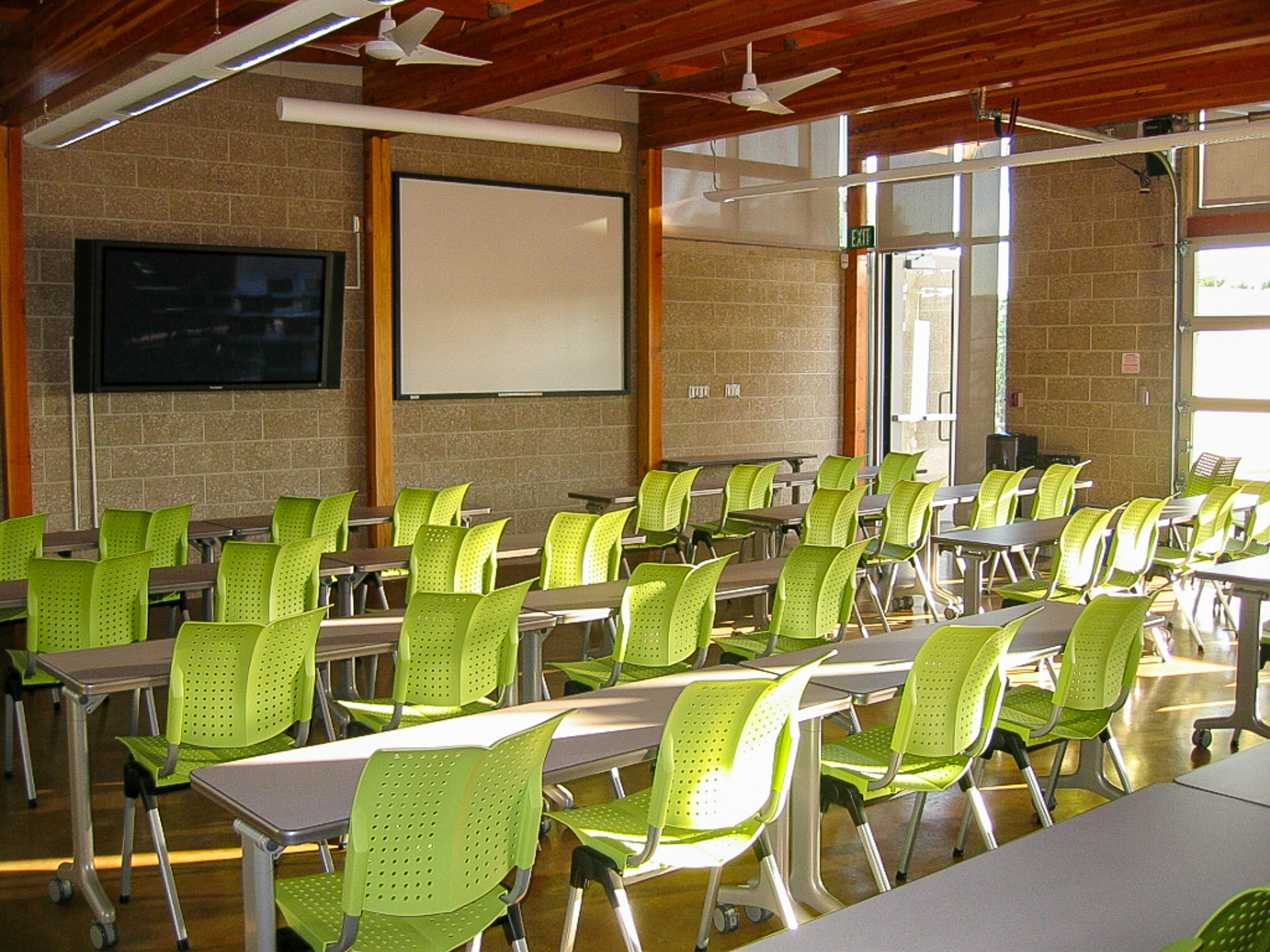 Green classroom chairs showing room layout and screen